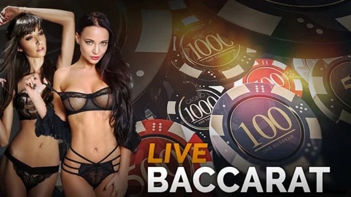 Two stunning live casino dealers hosting a baccarat game, with casino chips in the background.